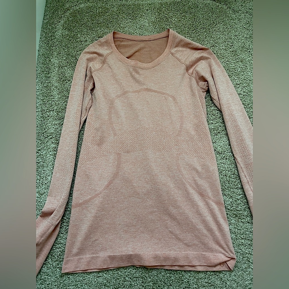 lululemon long sleeve swiftly. color is sunny coral i think!